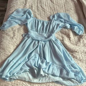 Blue flowing dress with lace in the back